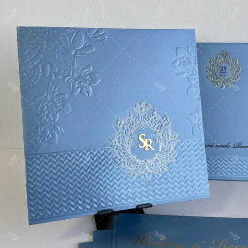 Ice Blue Card with Embossed Florals and Gold Foil Emblem for Lasercut Couple Initials in Silk Feel Paper