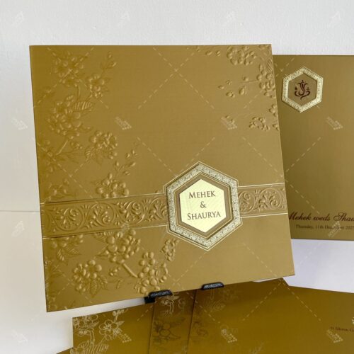American Gold Card with Embossed Florals and Gold Foil Emblem for Lasercut Couple Initials in Silk Feel Paper