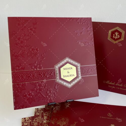 Berry Red Card with Embossed Florals and Gold Foil Emblem for Lasercut Couple Initials in Silk Feel Paper